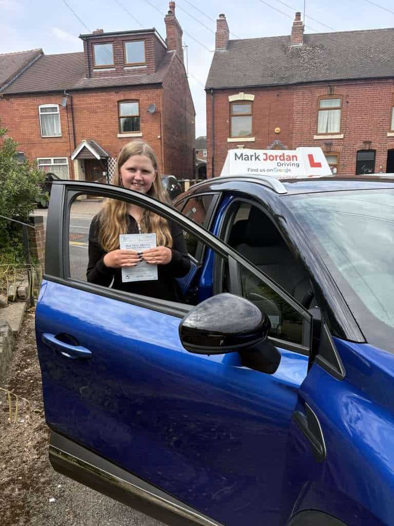 Learner driver celebrating a zero fault driving test pass at Burton Test Centre with Mark Jordan Driving School in Burton upon Trent.